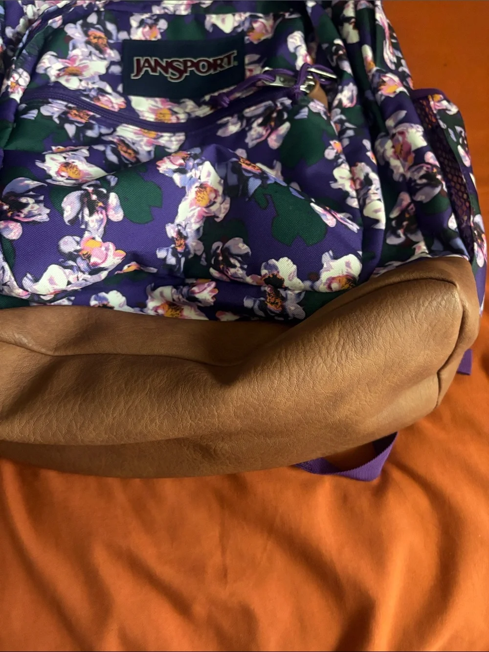 Jansport Purple Floral Backpack with Green Accents and Brown Base